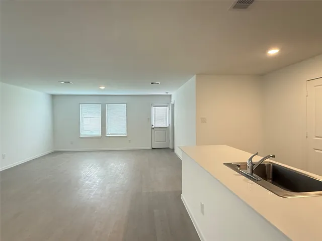 a view of a kitchen with a sink and dishwasher