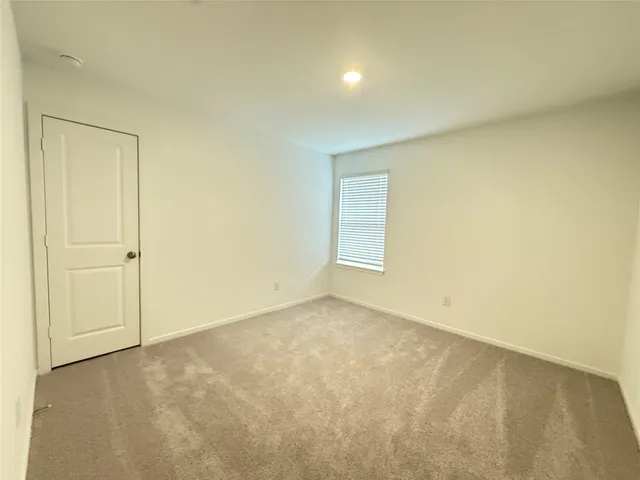 an empty room with a empty space and a window