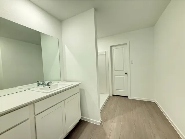 a bathroom with a shower and a toilet