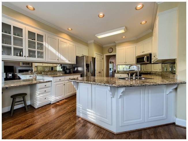 8000 Kukui Court Raleigh, NC 27613 - Photo 11 of 25 The well equipped kitchen will be sure to delight the cook in the house. Kitchen