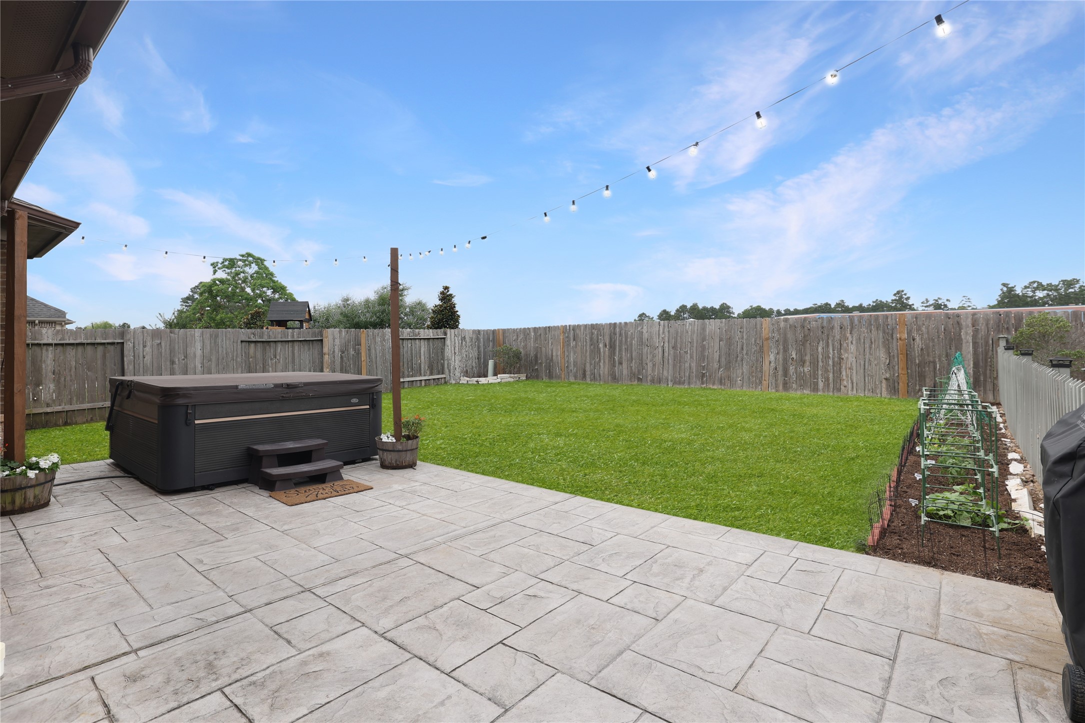 3639 Cottage Pines Lane Spring, TX 77386 - Photo 1 of 31 The patio extends into the large backyard. The hot tub/ spa comes with the house