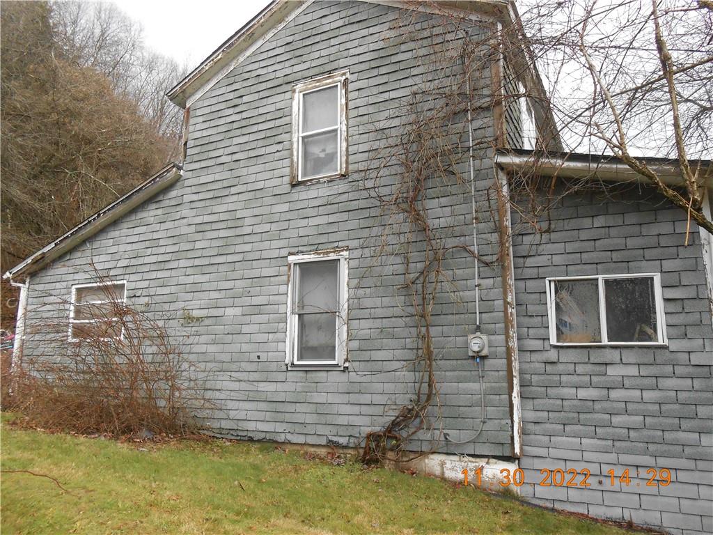 1610 Dixon Road Clymer, PA 15728 - Photo 3 of 14 a brick house with a yard