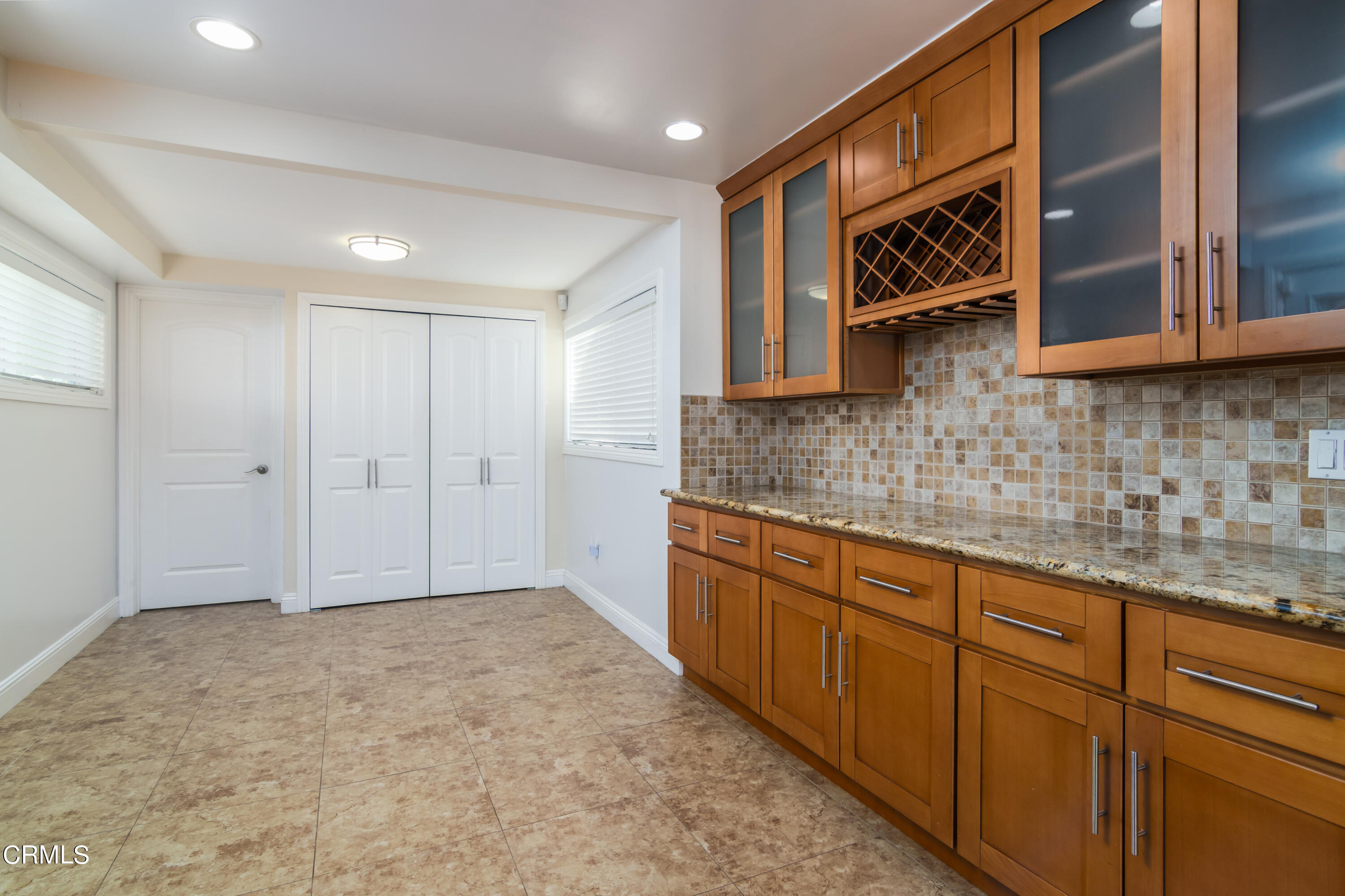 1275 Daveric Drive Pasadena, CA 91107 - Photo 11 of 29 a kitchen with stainless steel appliances granite countertop a sink and cabinets