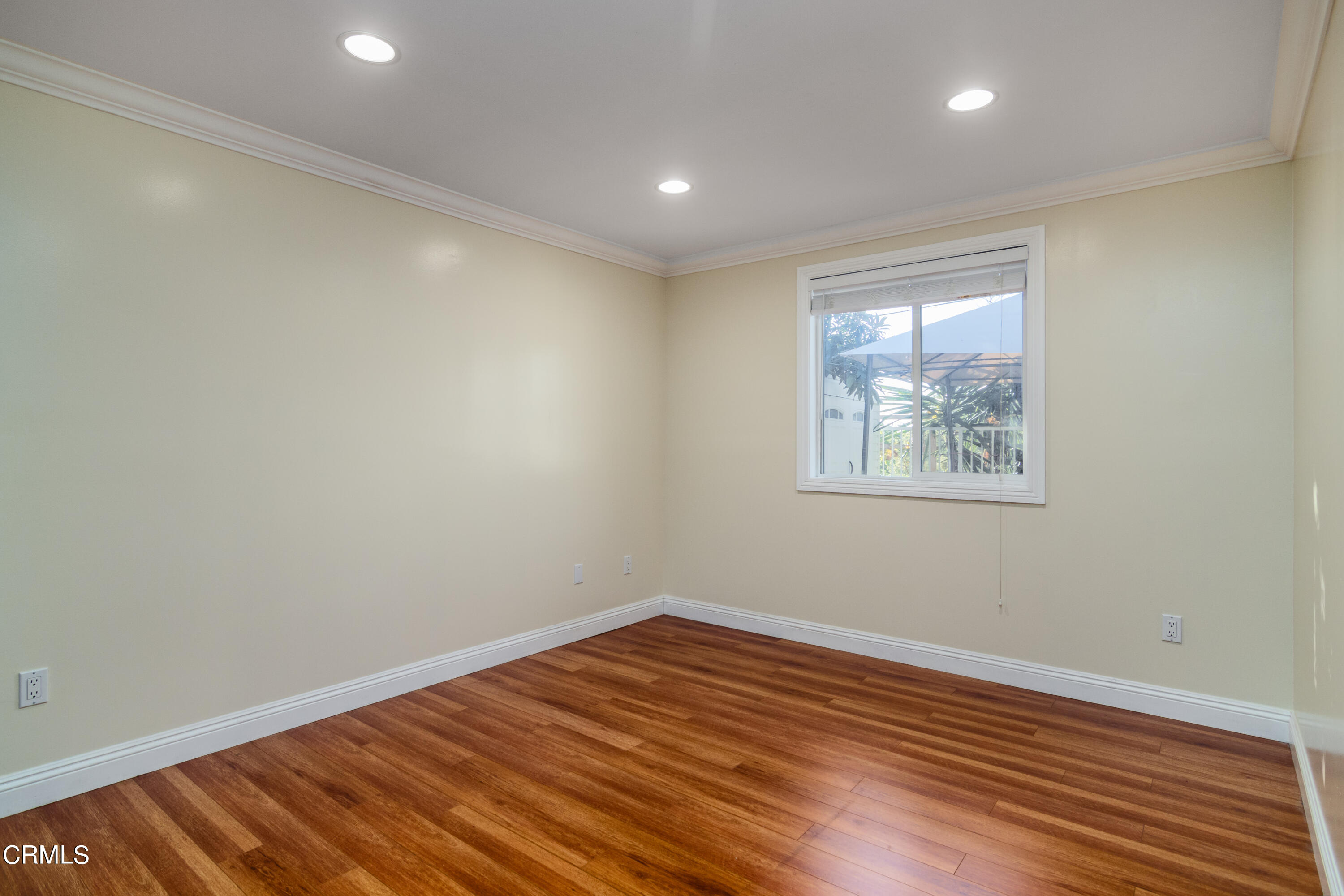 1275 Daveric Drive Pasadena, CA 91107 - Photo 14 of 29 an empty room with wooden floor and windows