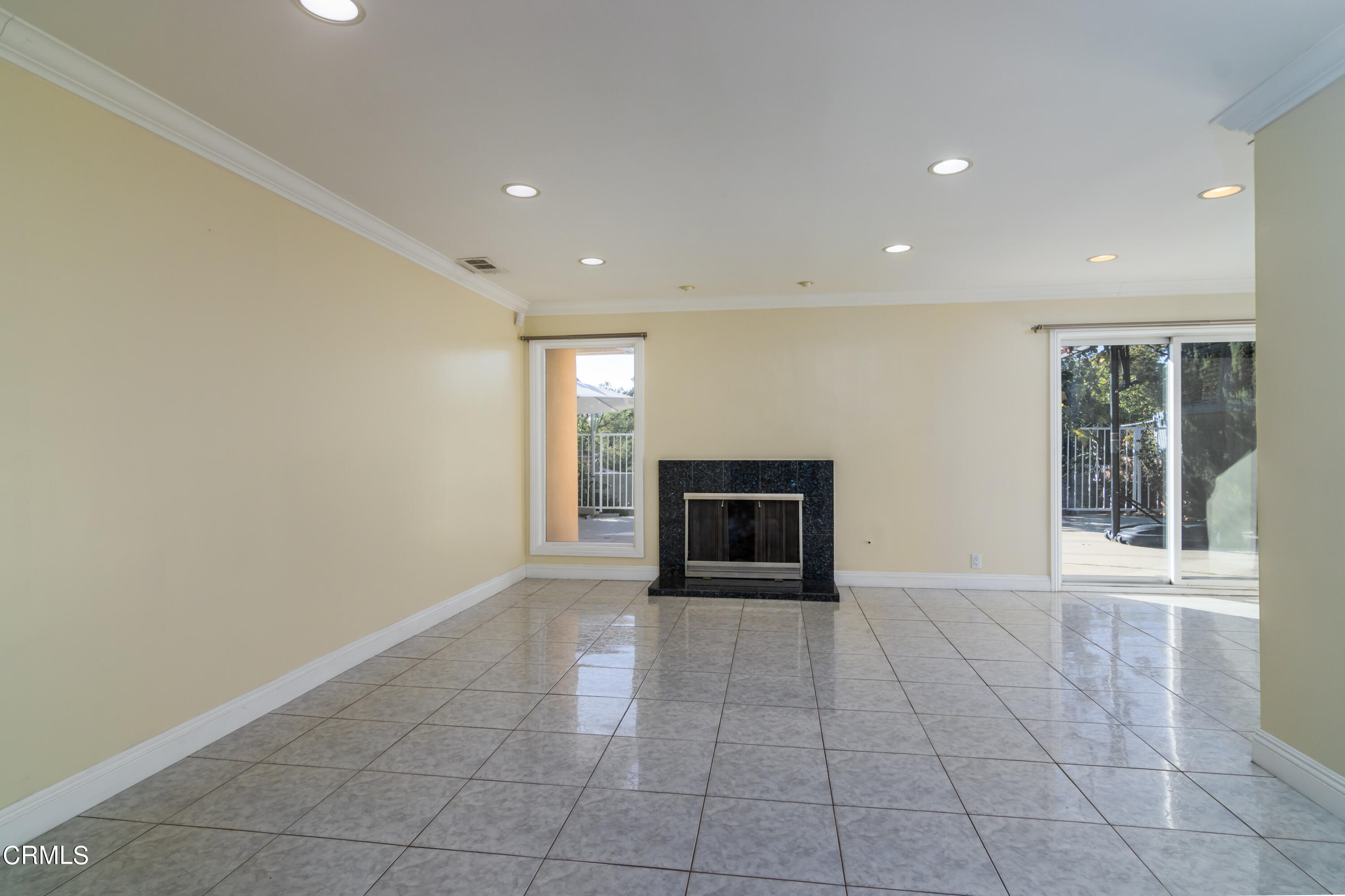 1275 Daveric Drive Pasadena, CA 91107 - Photo 3 of 29 a view of an empty room with a fireplace