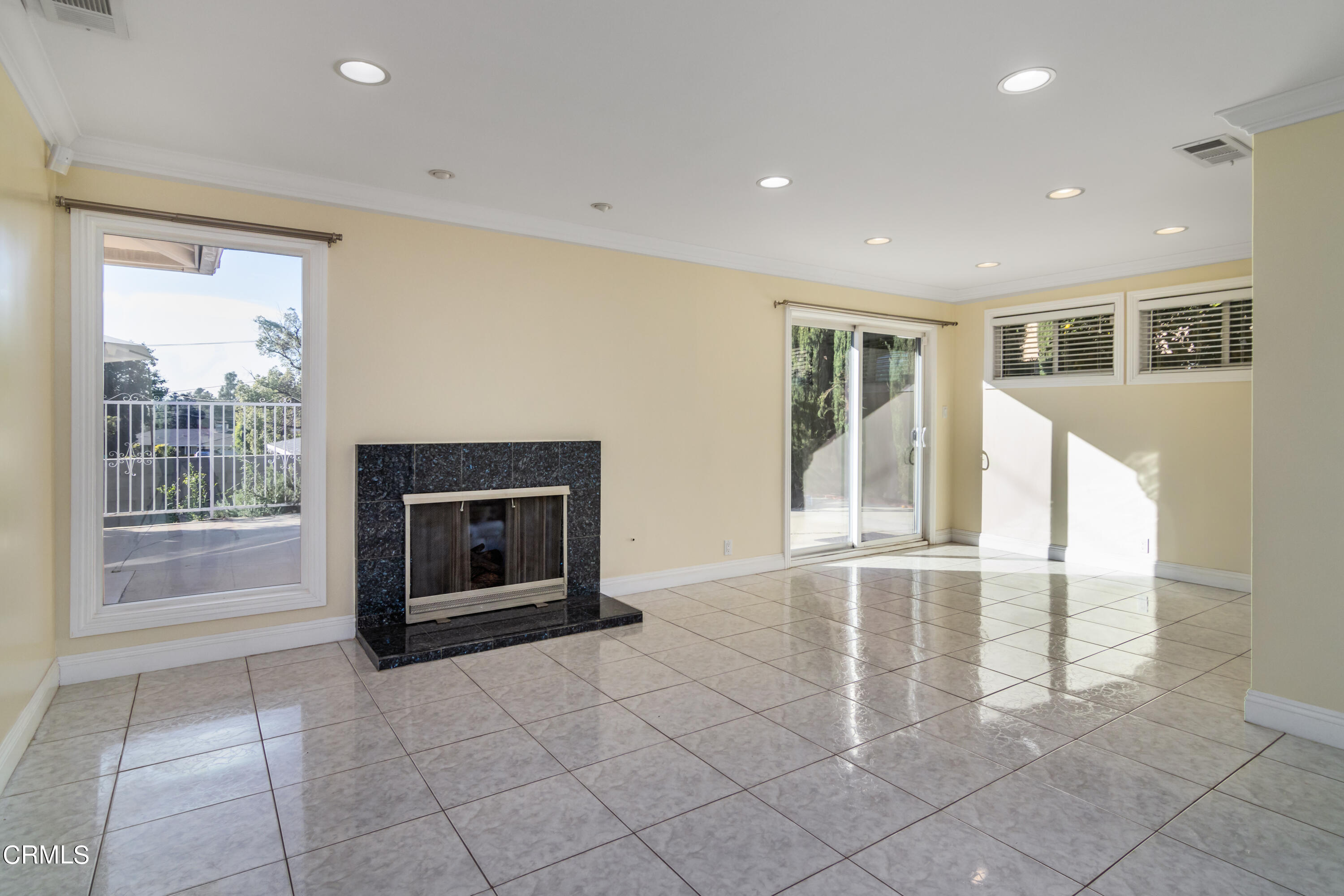 1275 Daveric Drive Pasadena, CA 91107 - Photo 4 of 29 a view of an empty room with a fireplace and a window