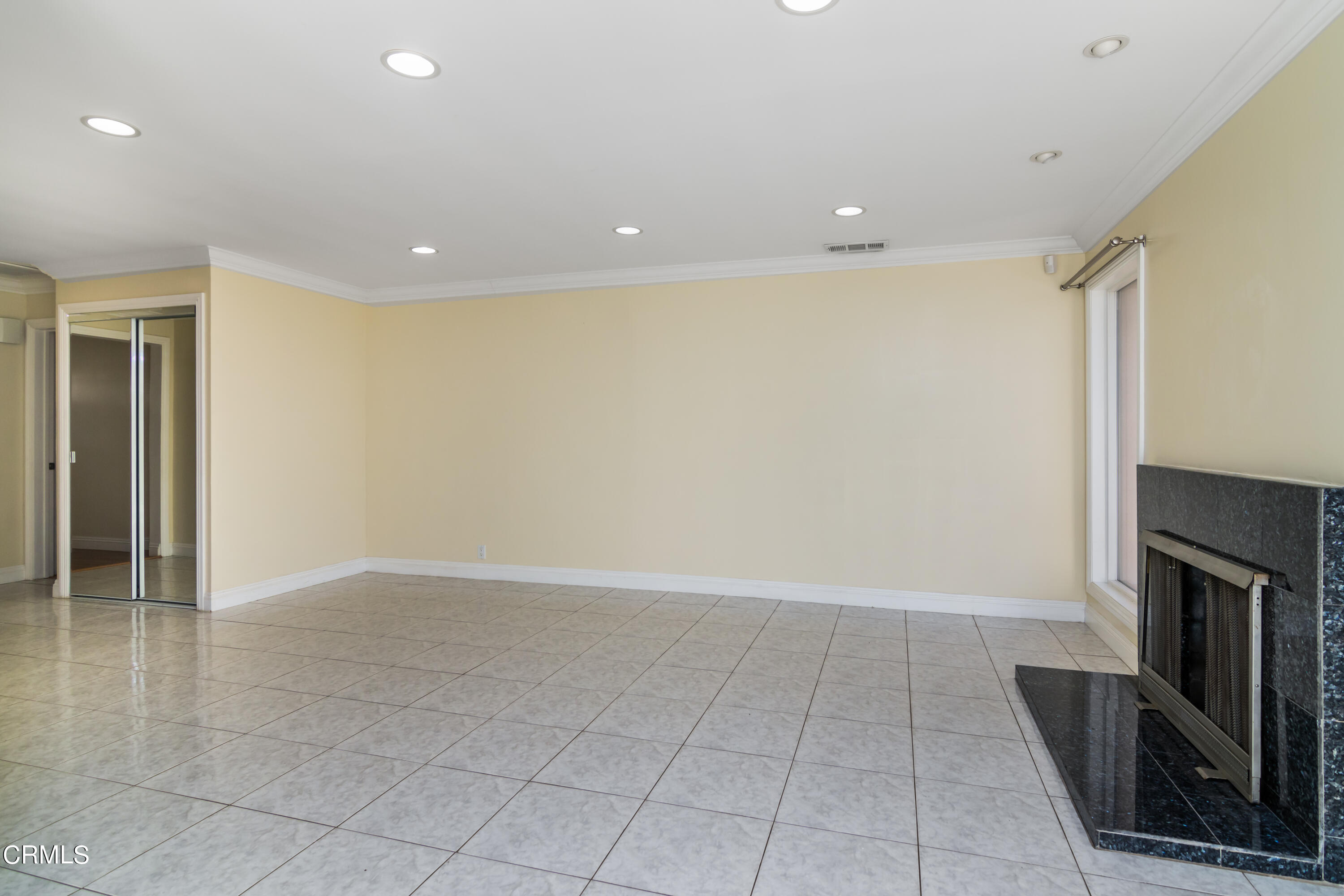 1275 Daveric Drive Pasadena, CA 91107 - Photo 5 of 29 an empty room with wooden floor and fireplace
