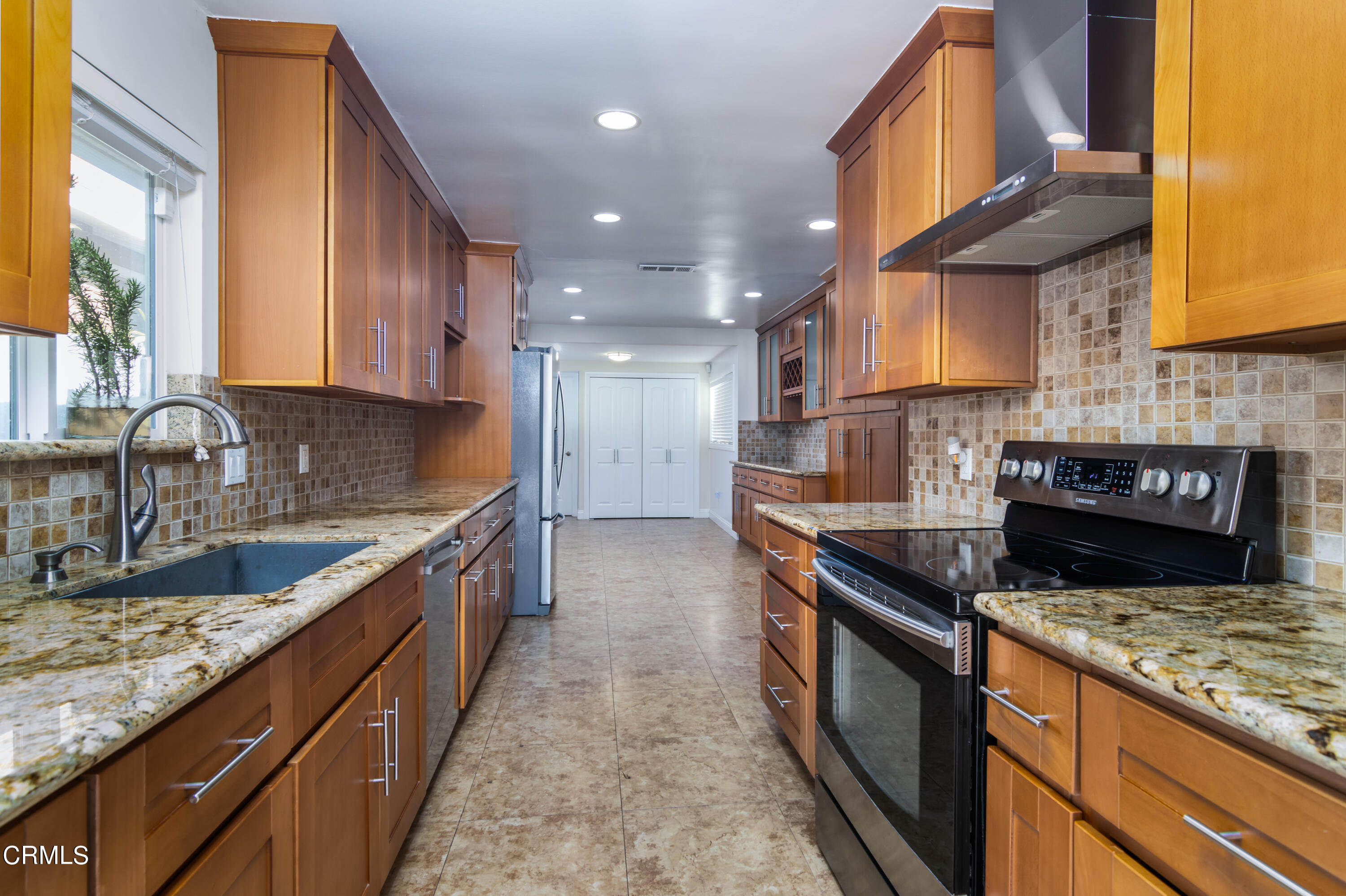 1275 Daveric Drive Pasadena, CA 91107 - Photo 7 of 29 a kitchen with stainless steel appliances granite countertop a sink stove and refrigerator