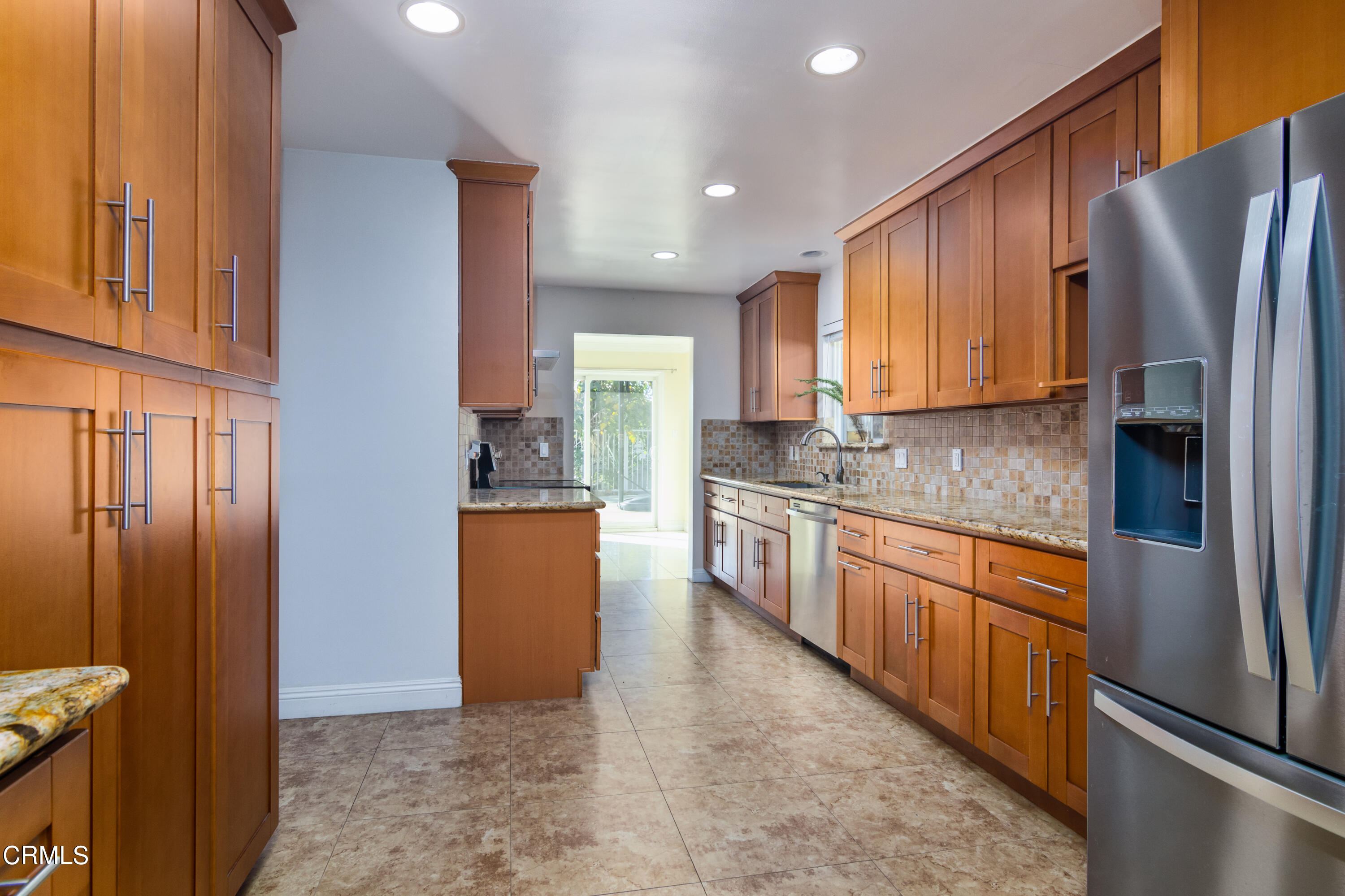 1275 Daveric Drive Pasadena, CA 91107 - Photo 8 of 29 a kitchen with stainless steel appliances granite countertop a refrigerator a stove and a sink with wooden floor