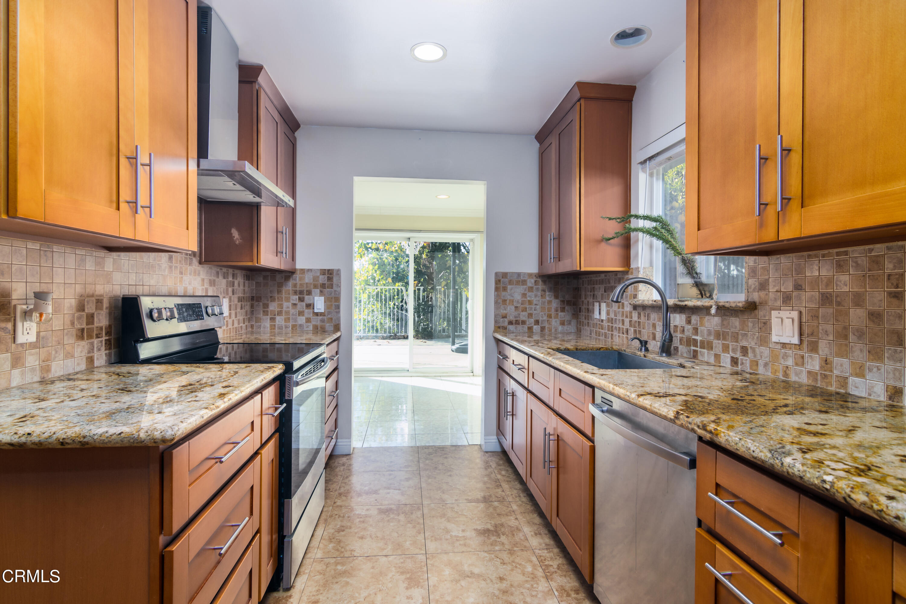 1275 Daveric Drive Pasadena, CA 91107 - Photo 9 of 29 a kitchen with stainless steel appliances granite countertop a sink stove and cabinets