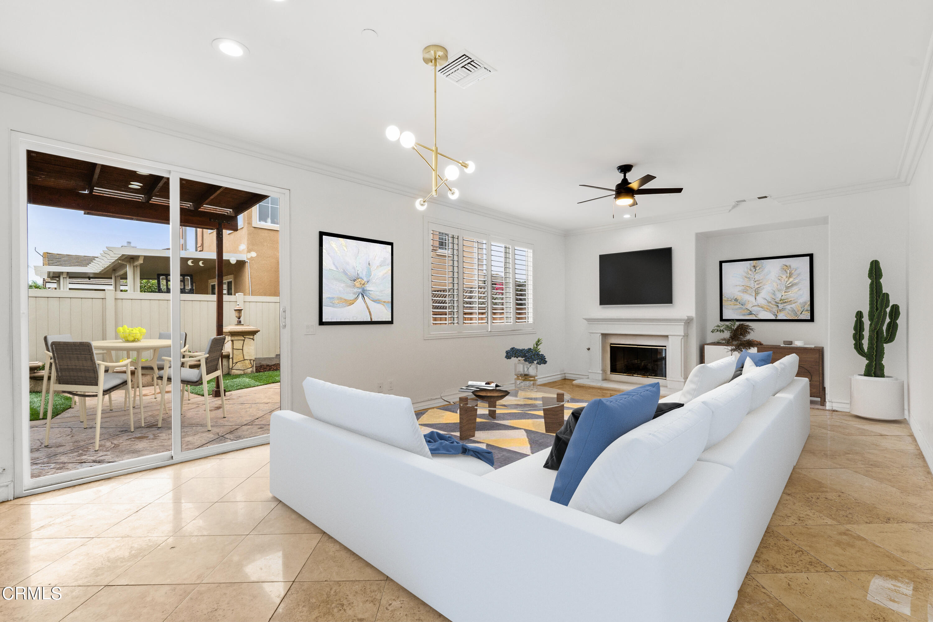 727 Entrada Drive Oxnard, CA 93030 - Photo 5 of 12 a living room with furniture a chandelier and a flat screen tv