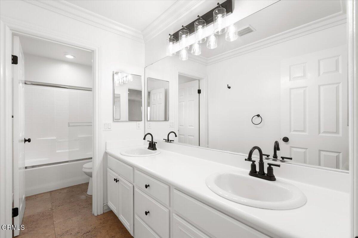 727 Entrada Drive Oxnard, CA 93030 - Photo 10 of 12 a bathroom with a sink double vanity and a mirror
