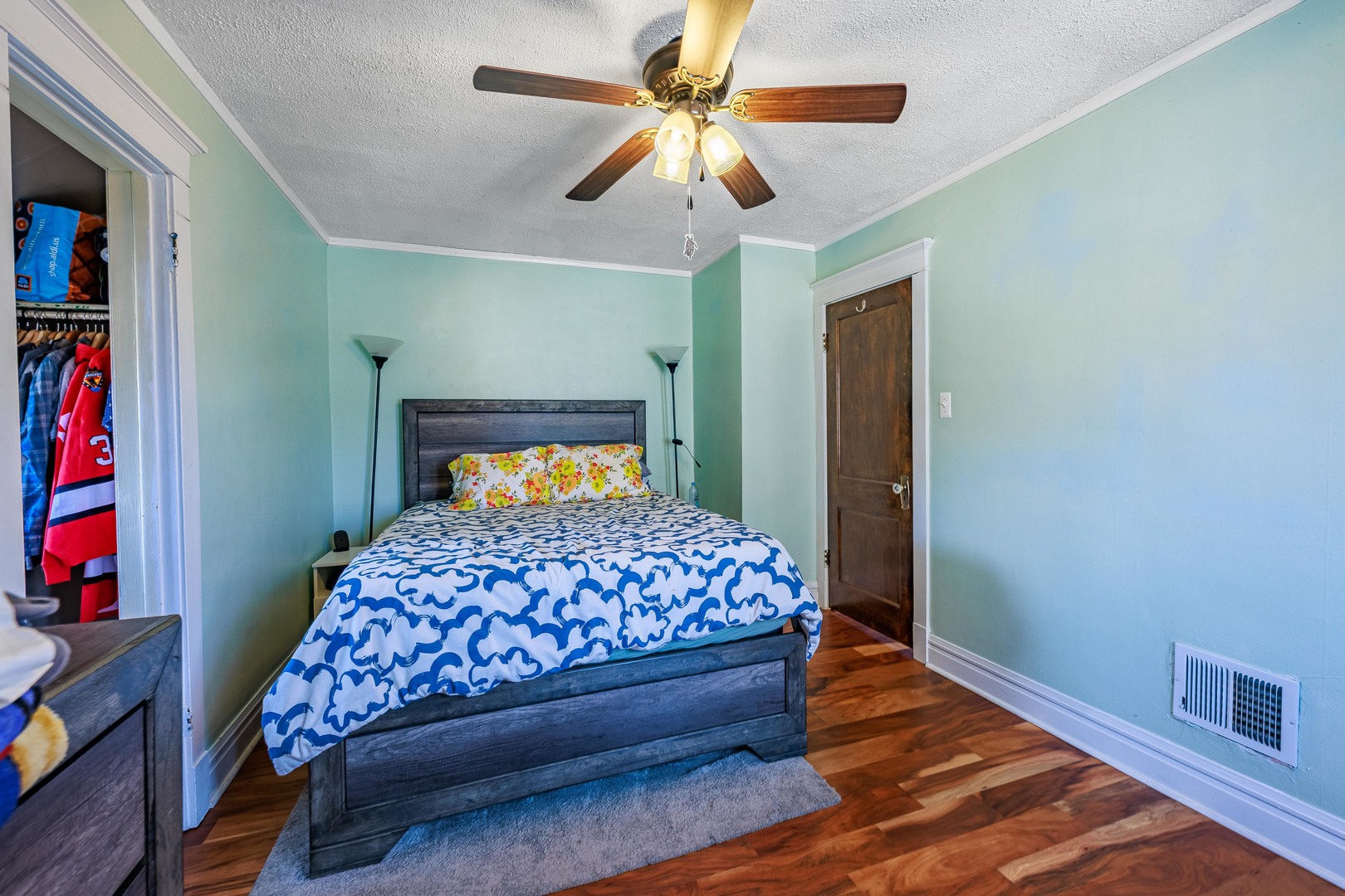 410 Repton Road Riverside, IL 60546 - Photo 16 of 30 a bedroom with a bed and a chandelier