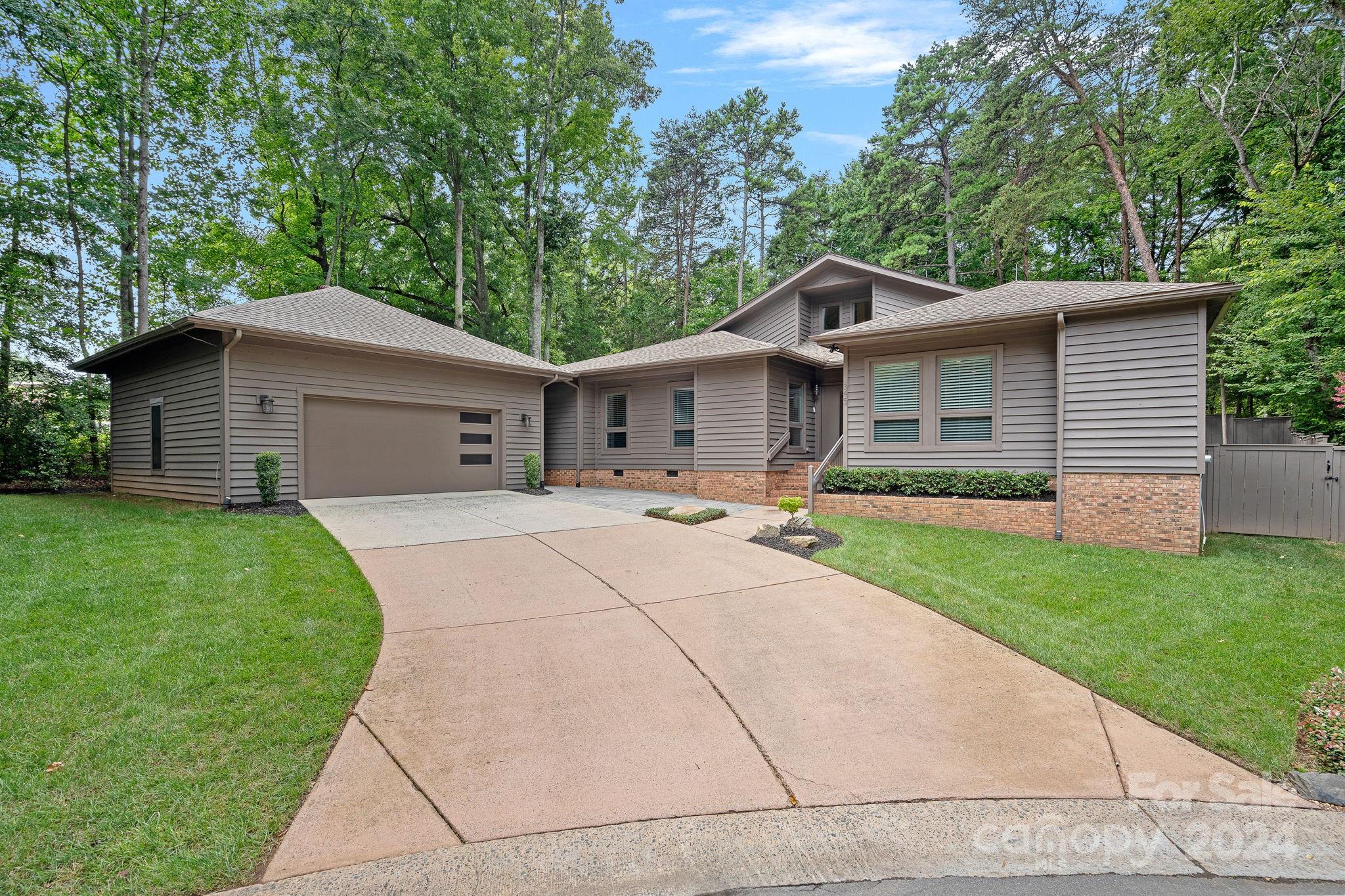 345 Jib Court Davidson, NC 28036 - Photo 1 of 40 a front view of house with yard and green space
