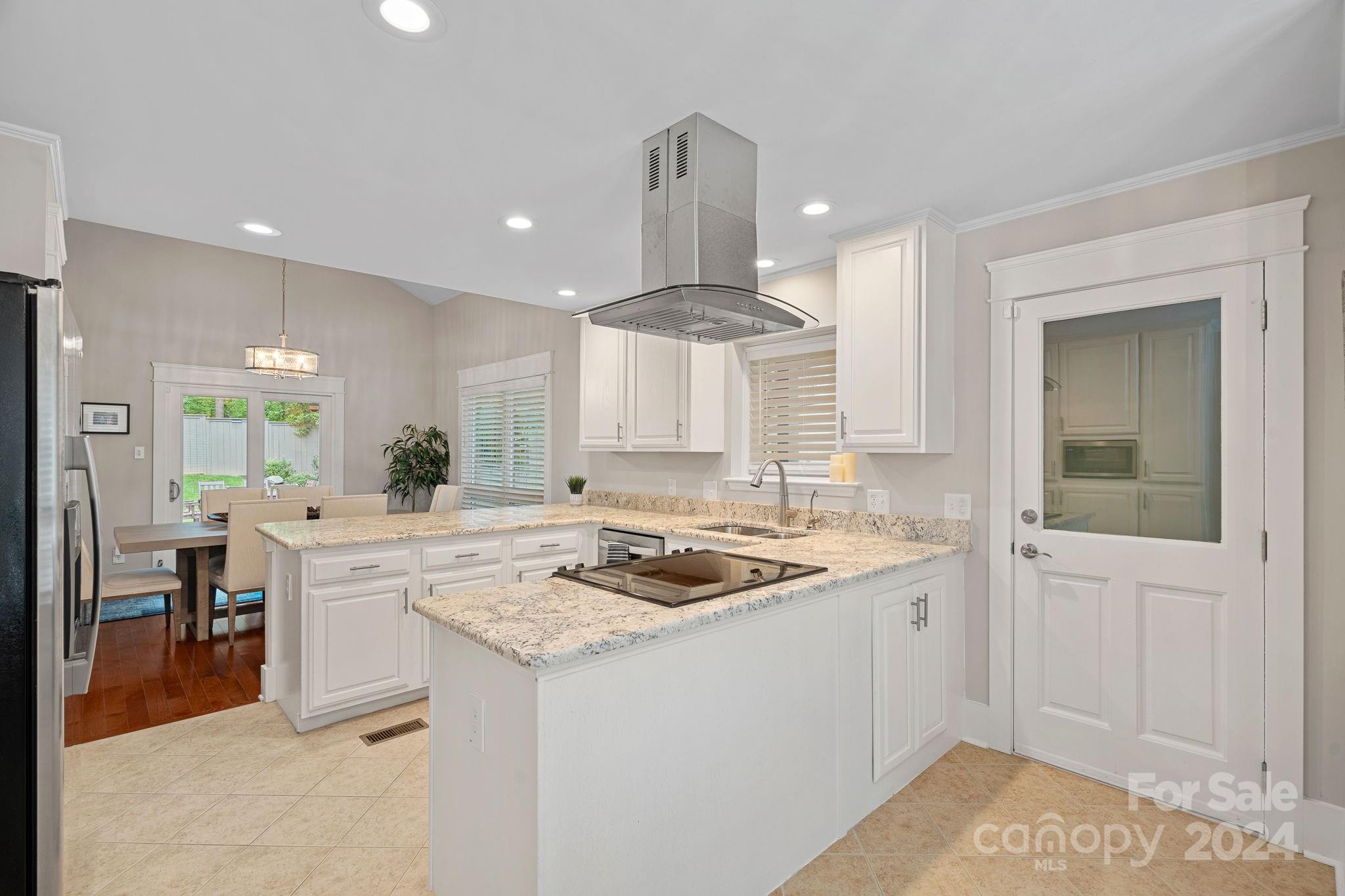 345 Jib Court Davidson, NC 28036 - Photo 13 of 40 a kitchen with a sink stove and cabinets
