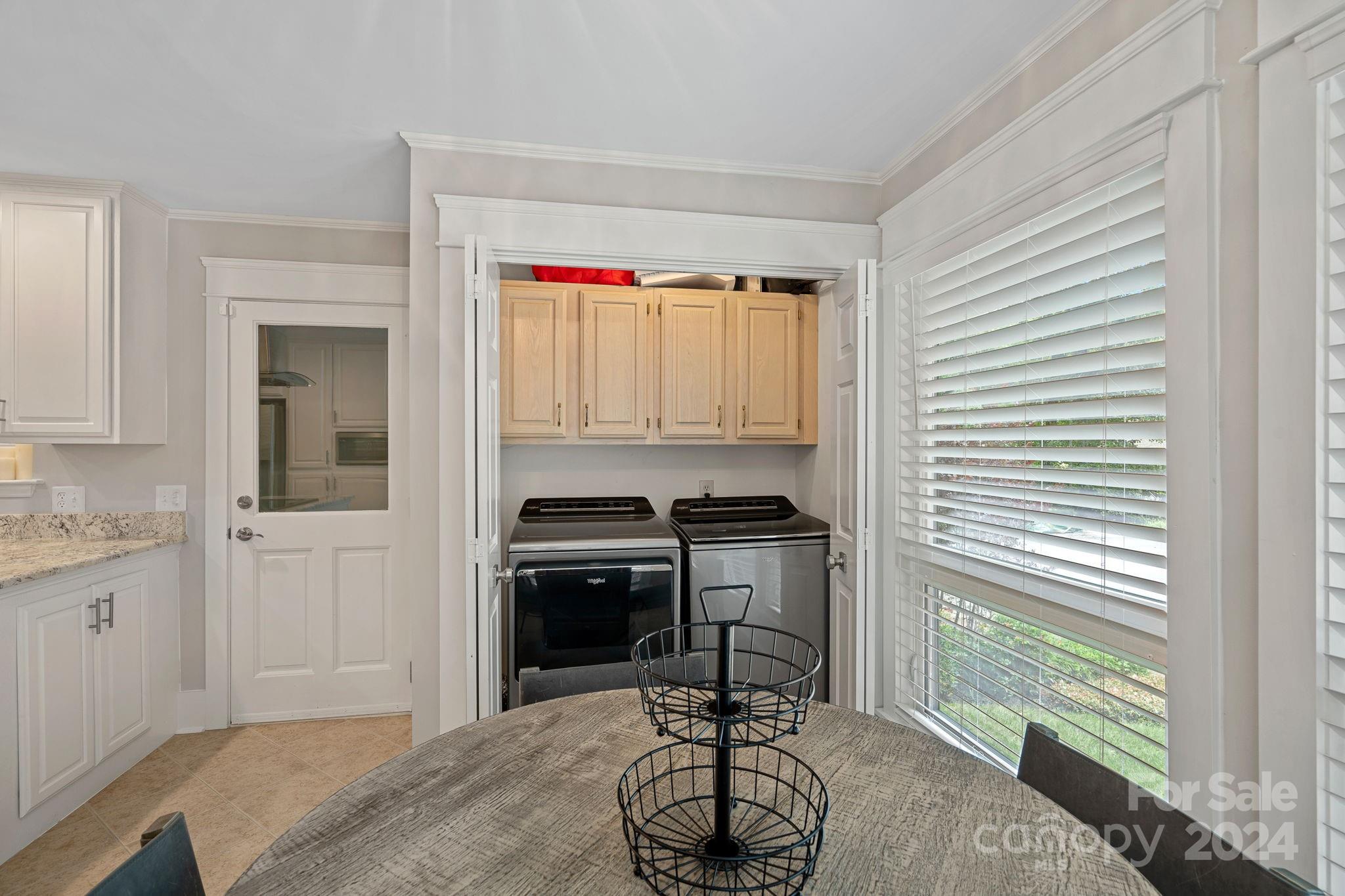 345 Jib Court Davidson, NC 28036 - Photo 17 of 40 a kitchen with a sink a stove and a window