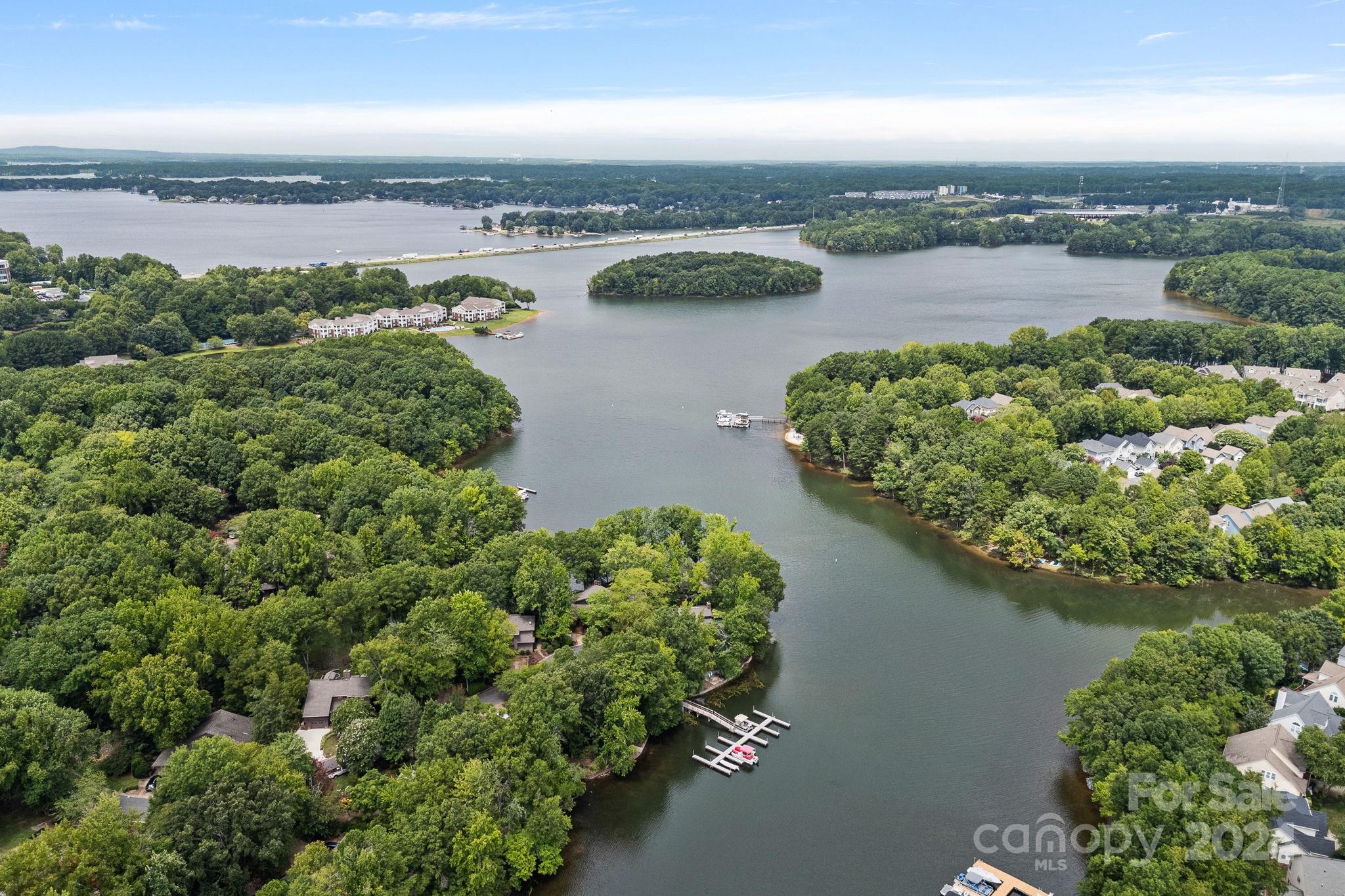 345 Jib Court Davidson, NC 28036 - Photo 2 of 40 an aerial view of a city with lots of residential buildings lake and ocean view
