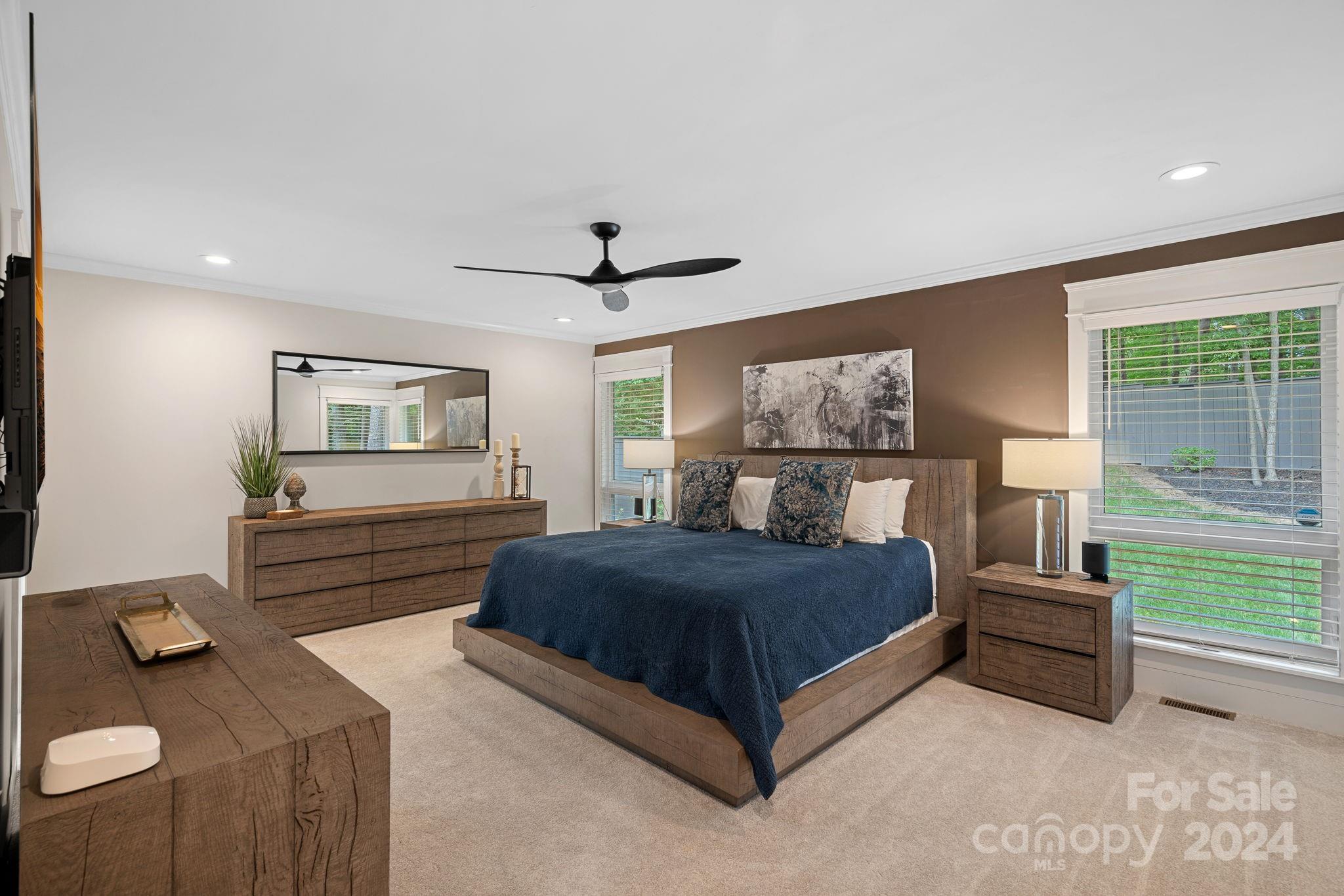 345 Jib Court Davidson, NC 28036 - Photo 22 of 40 a bedroom with a bed and wooden floor