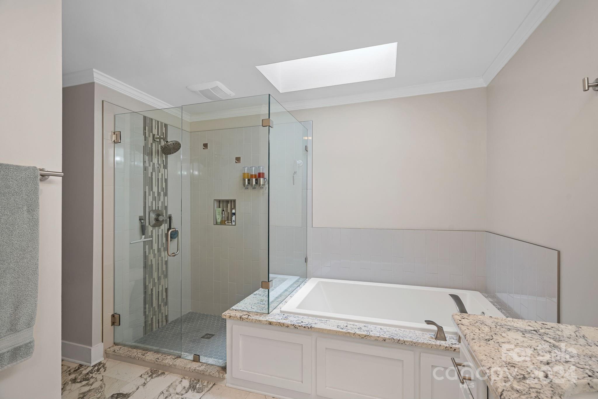 345 Jib Court Davidson, NC 28036 - Photo 24 of 40 a bathroom with a bathtub and shower