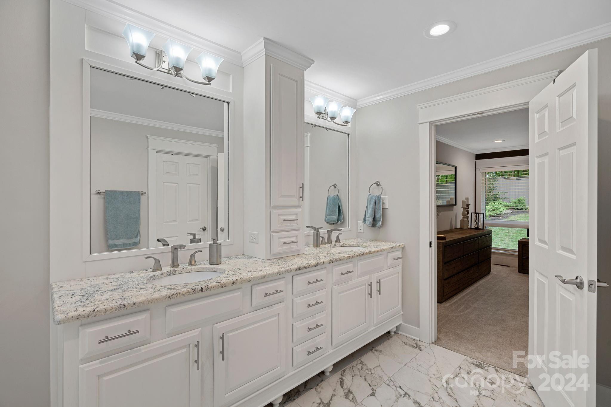 345 Jib Court Davidson, NC 28036 - Photo 25 of 40 a spacious bathroom with a granite countertop sink a mirror and a