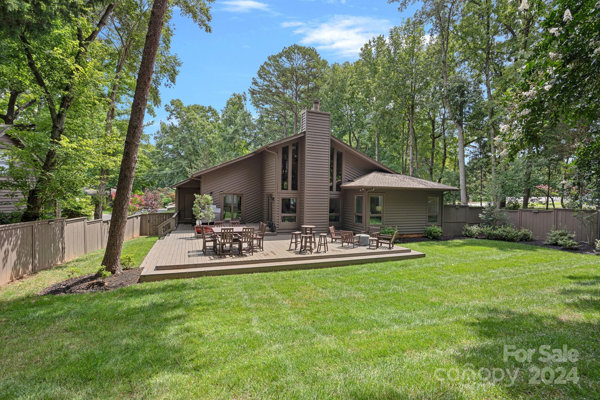 345 Jib Court Davidson, NC 28036 - Photo 30 of 40 a view of a house with backyard porch and sitting area