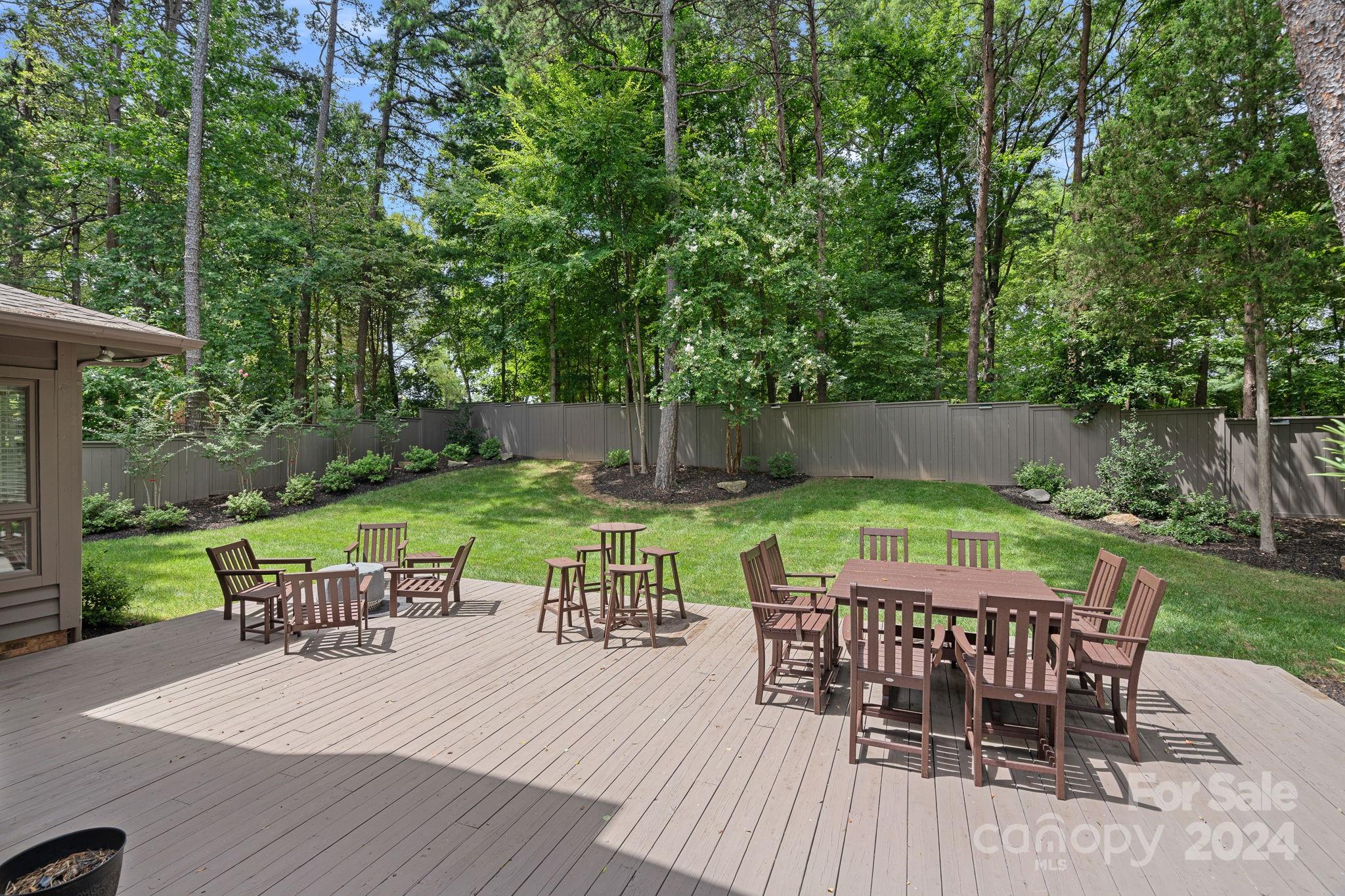 345 Jib Court Davidson, NC 28036 - Photo 33 of 40 a view of a patio with a table chairs and a backyard