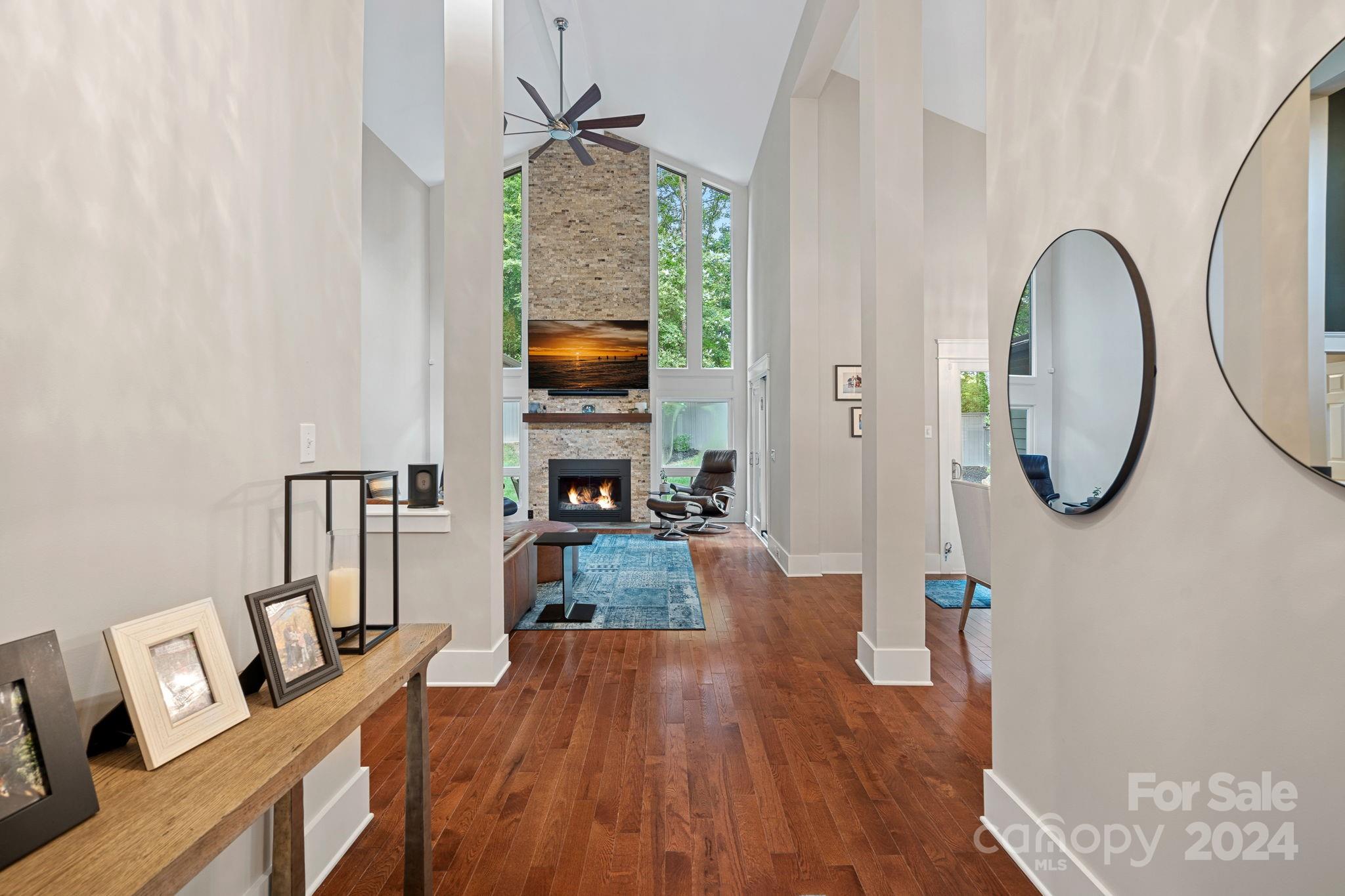 345 Jib Court Davidson, NC 28036 - Photo 4 of 40 a view of living room with furniture a flat screen tv and wooden floor