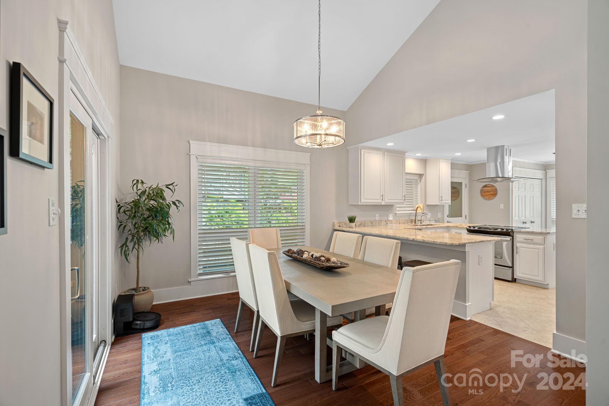 345 Jib Court Davidson, NC 28036 - Photo 8 of 40 a view of a dining room with furniture and wooden floor