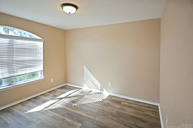 a view of an empty room and window