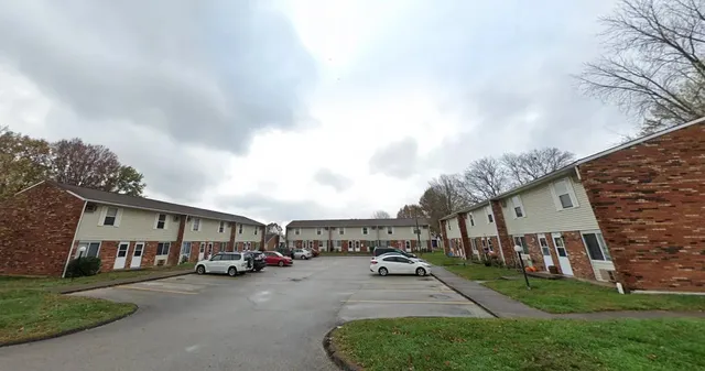 a view of a car park in front of house