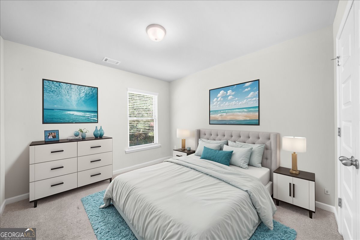 220 Harrison Street Calhoun, GA 30701 - Photo 13 of 17 a bedroom with a bed and a flat screen tv