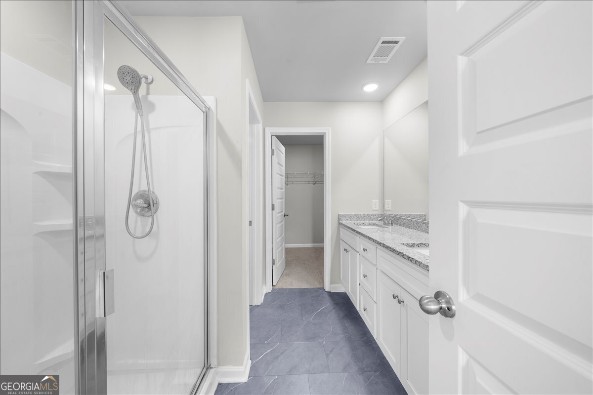 220 Harrison Street Calhoun, GA 30701 - Photo 15 of 17 a bathroom with a granite countertop shower sink and mirror
