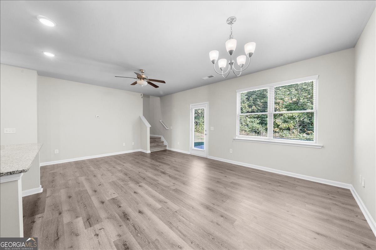 220 Harrison Street Calhoun, GA 30701 - Photo 6 of 17 wooden floor in an empty room with a window