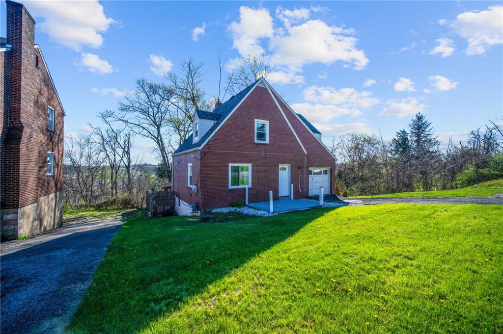 4030 Lebanon Church Road West Mifflin, PA 15122 - Photo 38 of 45 a house view with a garden space