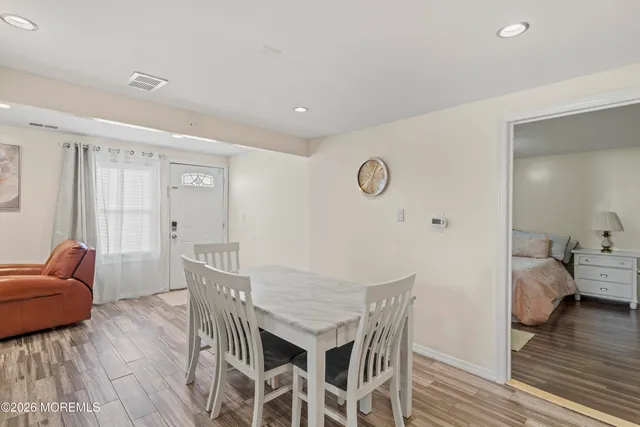 a view of a livingroom with furniture and wooden floor