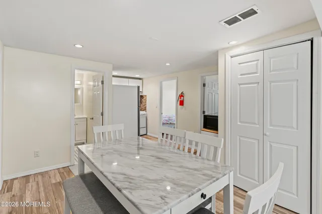 a view of a kitchen island with wooden floor