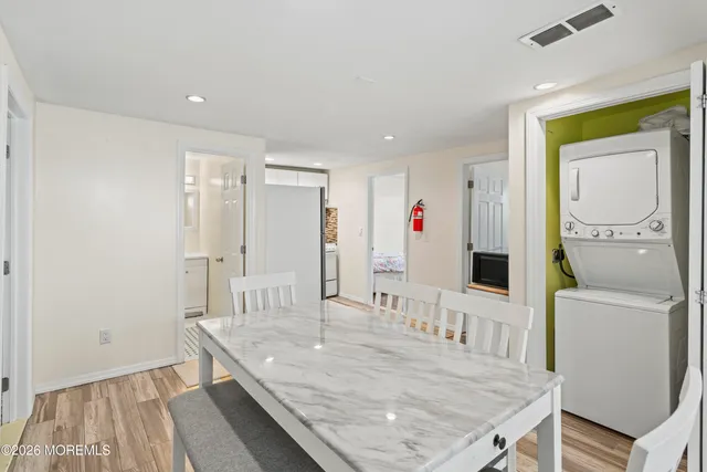 a living room with a table and chairs