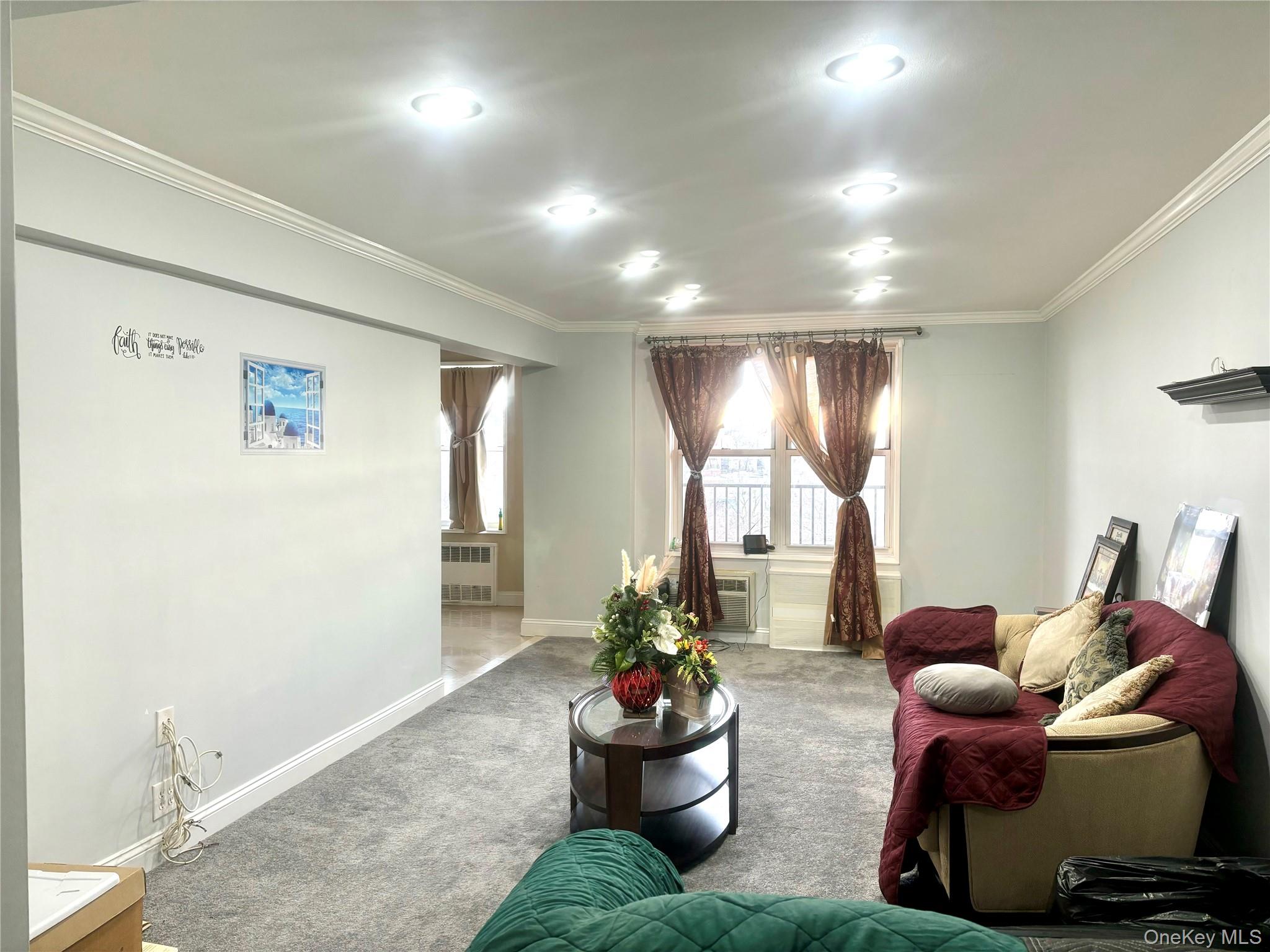 61 Bronx River Road, Unit 7H Yonkers, NY 10704 - Photo 4 of 13 a living room with furniture and a large window