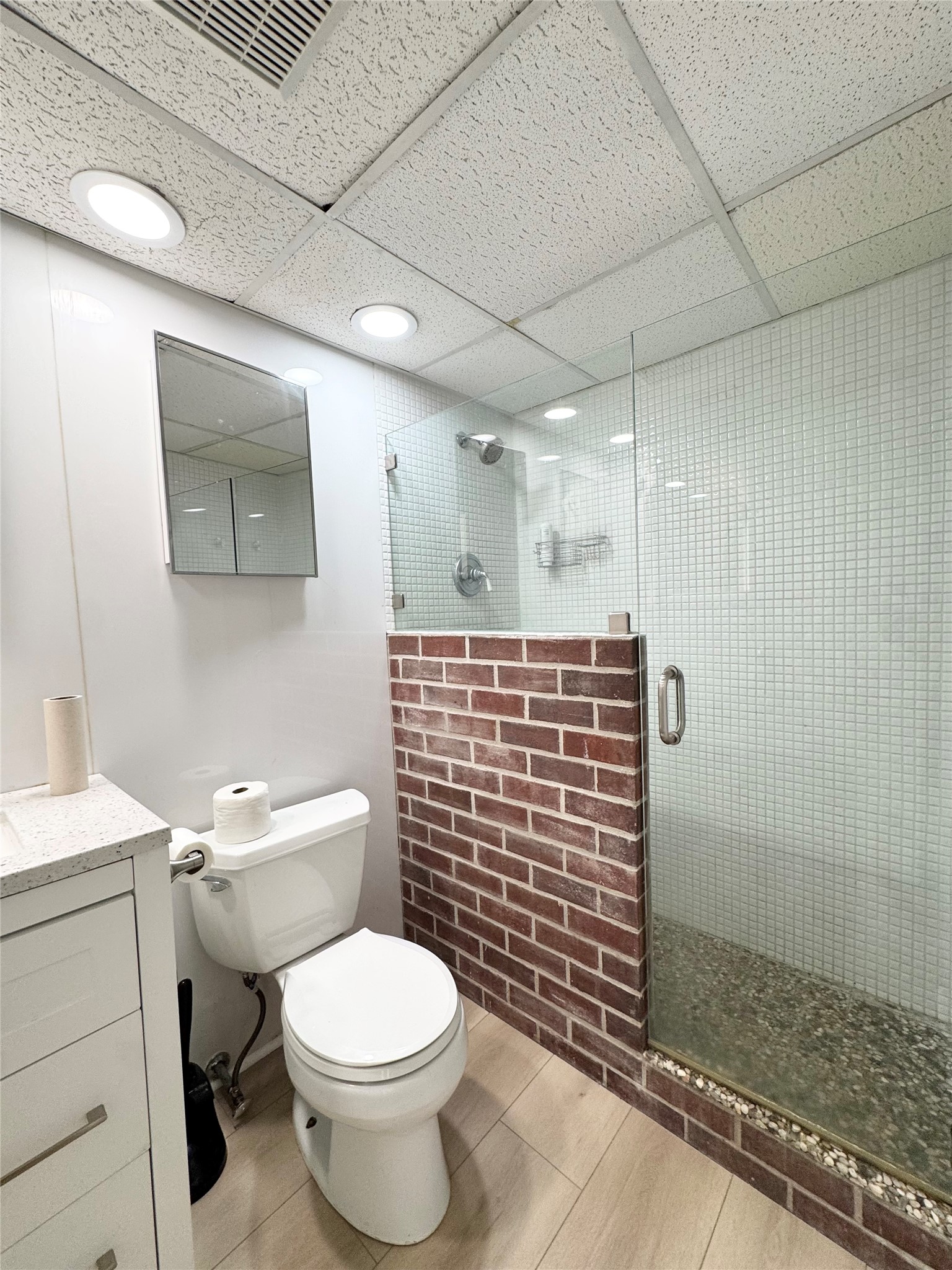 1800 Lavaca Street, Unit 705 Austin, TX 78701 - Photo 13 of 18 a bathroom with a toilet and shower