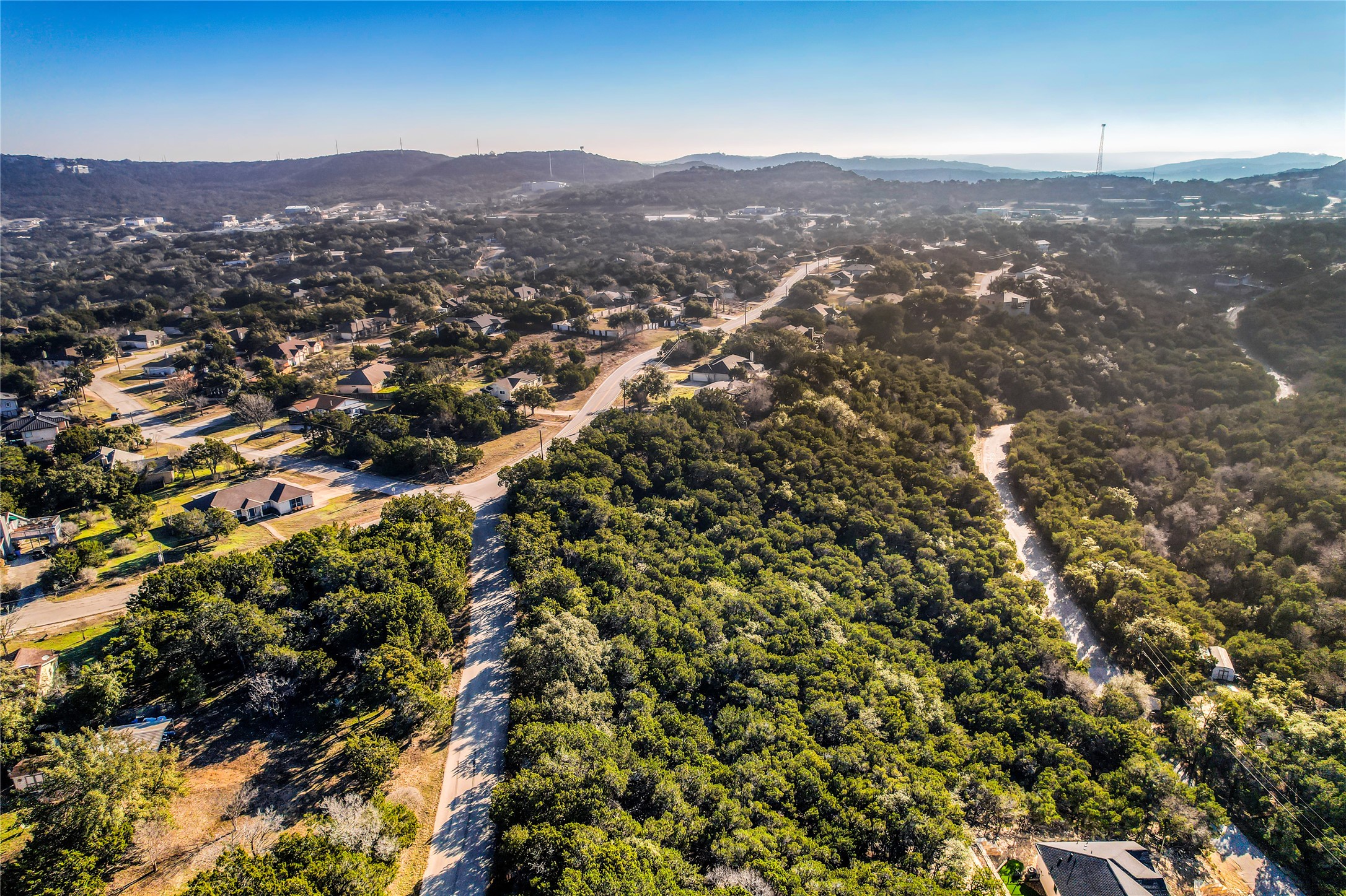 21005 Ridgeview Loop Lago Vista, TX 78645 - Photo 14 of 22 an aerial view of residential houses with city view and mountain view in back
