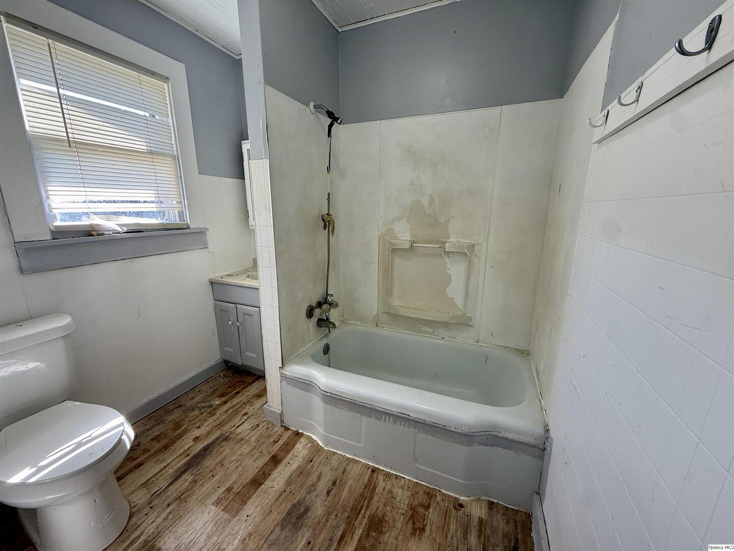 622 East Center Street Loraine, IL 62349 - Photo 7 of 21 a bathroom with a toilet and a shower