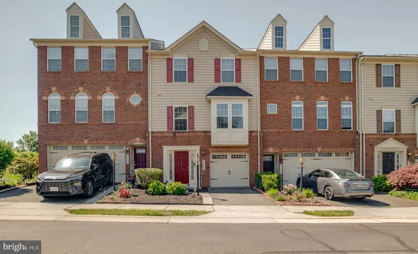 a car parked in front of a brick house
