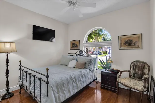 a bedroom with furniture and a window