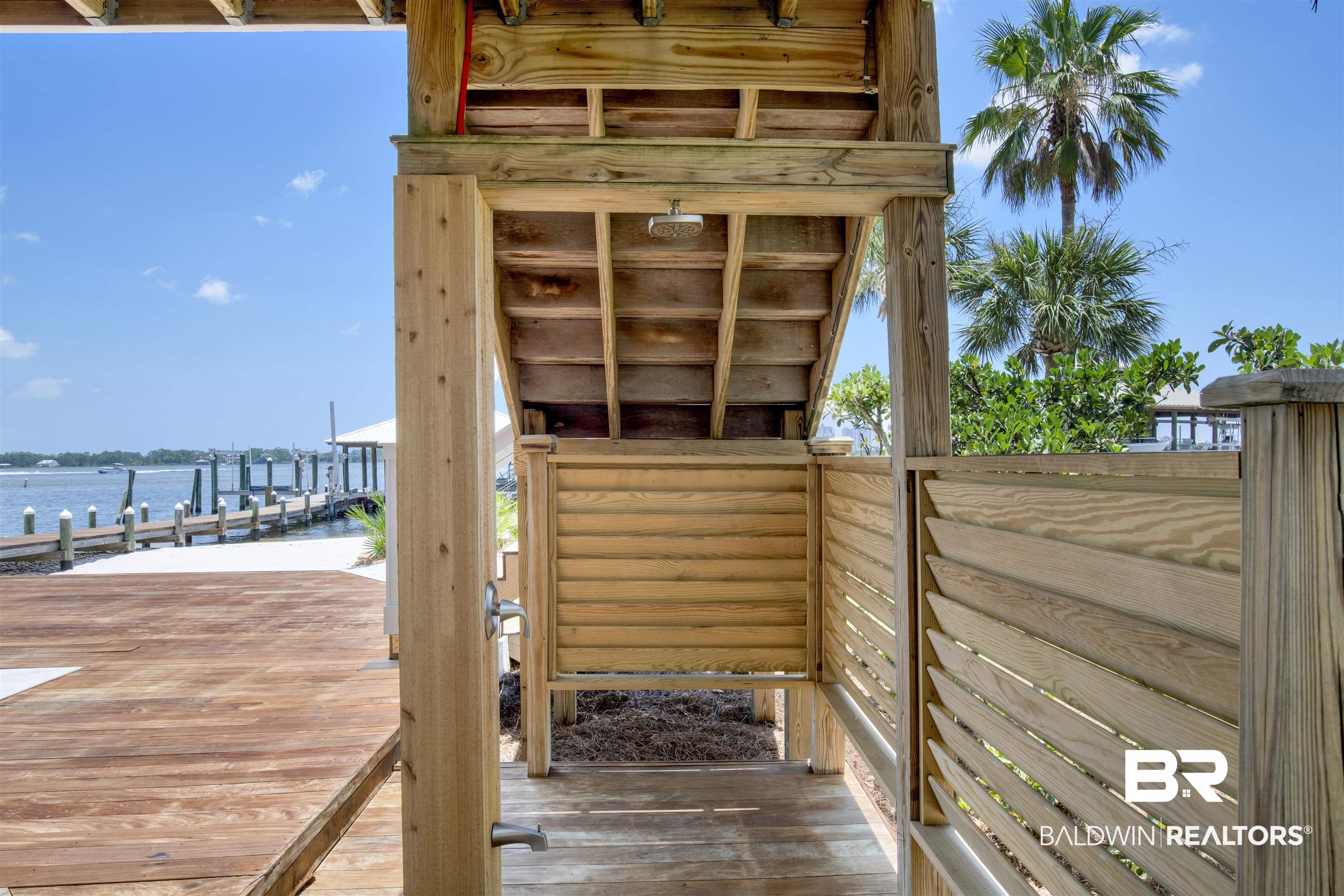 33400 River Road Orange Beach, AL 36561 - Photo 16 of 72 Wooden terrace featuring a boat dock and a water view