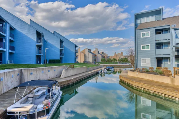 a swimming pool with outdoor seating and yard