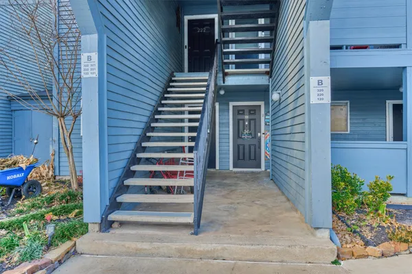 a view of a house with entryway and wooden floor