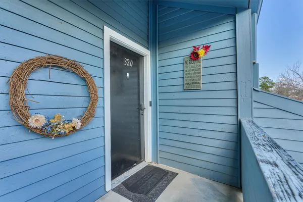 a view of entryway with wooden door