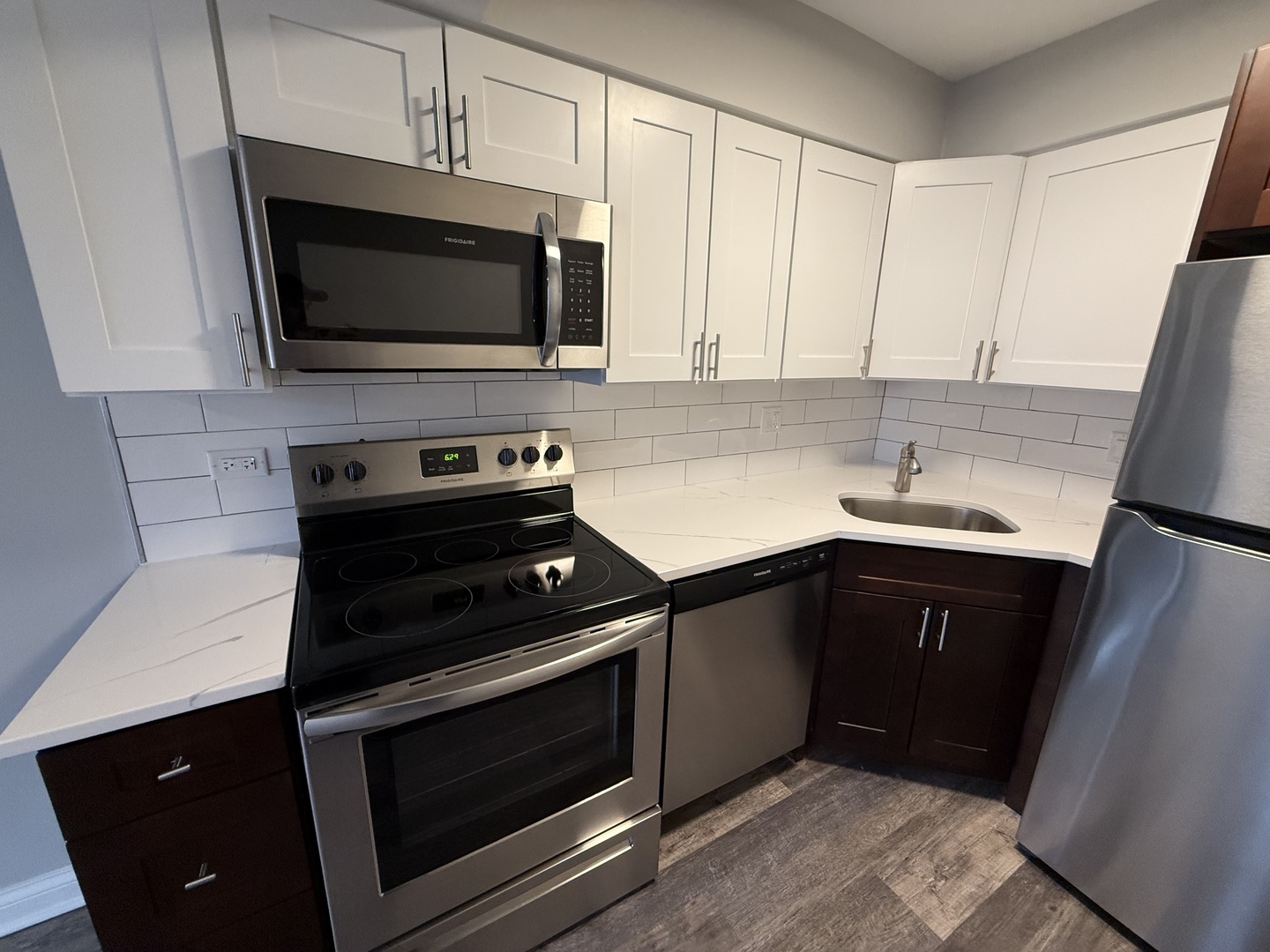 744 West Gordon Terrace, Unit 303 Chicago, IL 60613 - Photo 7 of 14 a kitchen with a sink stove and microwave