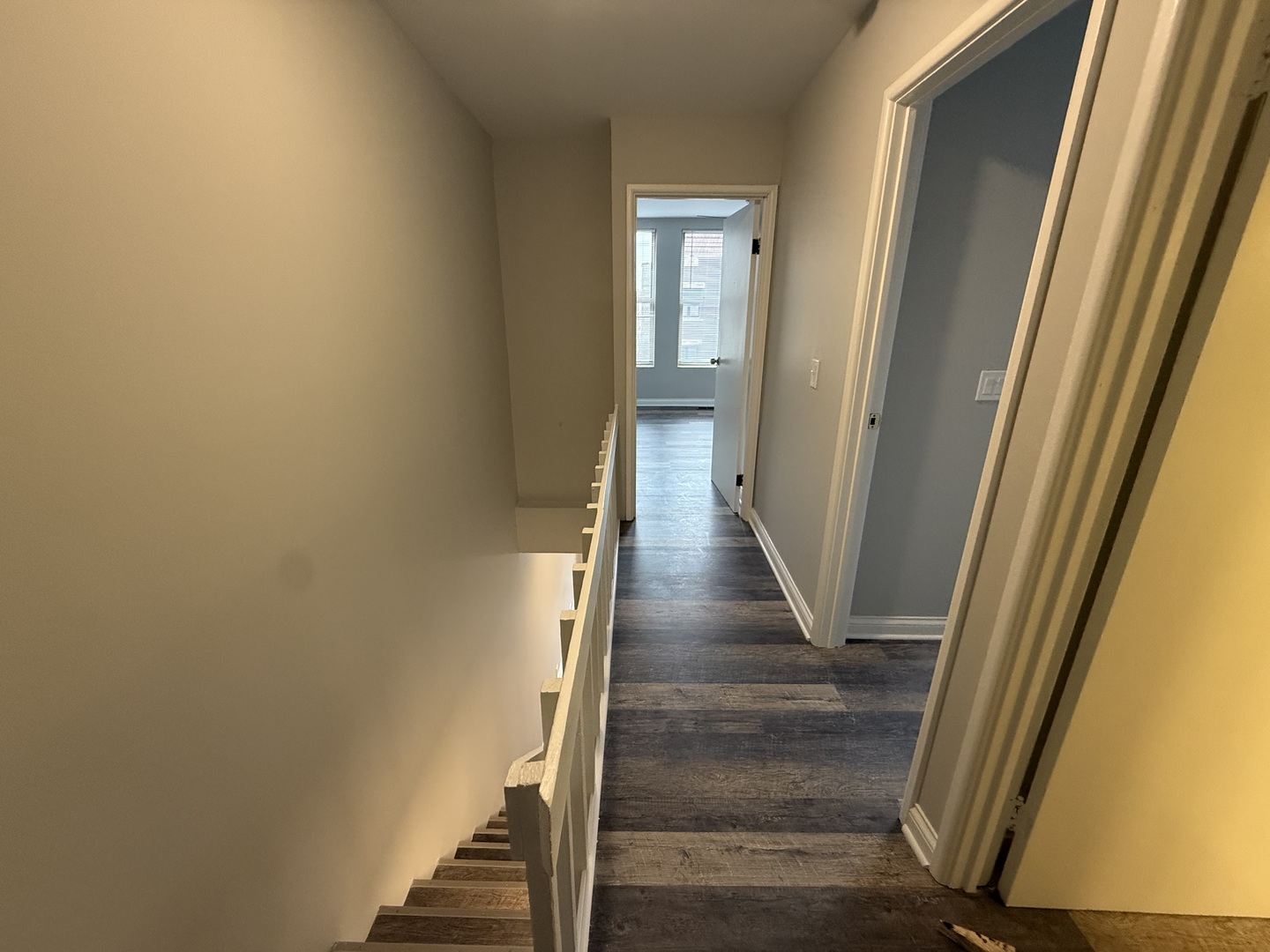 744 West Gordon Terrace, Unit 303 Chicago, IL 60613 - Photo 9 of 14 a view of a hallway with wooden floor and entryway
