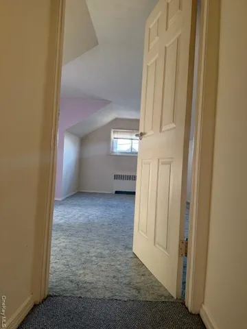 a view of a hallway with front door